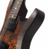 Close-up of upper body horn showing textured dark finish, burled wood grain, and black neck pickup. card