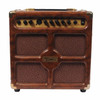 Front view of Dean DA30-4 acoustic combo amplifier with brown cabinet, four speaker grille sections, and gold control panel. card