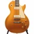 Close front view of Gibson Les Paul Goldtop showing metallic gold finish, cream P-90 pickups and pickguard, Tune-O-Matic bridge, and amber control knobs. Close front view of Gibson Les Paul Goldtop showing metallic gold finish, cream P-90 pickups and pickguard, Tune-O-Matic bridge, and amber control knobs.