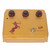 Front view of Warm Audio Centavo gold overdrive pedal with three brown control knobs, footswitch, and centaur graphic.