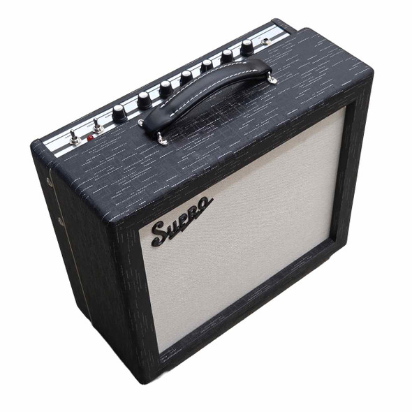 Angled front view of Supro Amulet combo amplifier showing cream grille cloth, top-mounted controls, and carrying handle. card