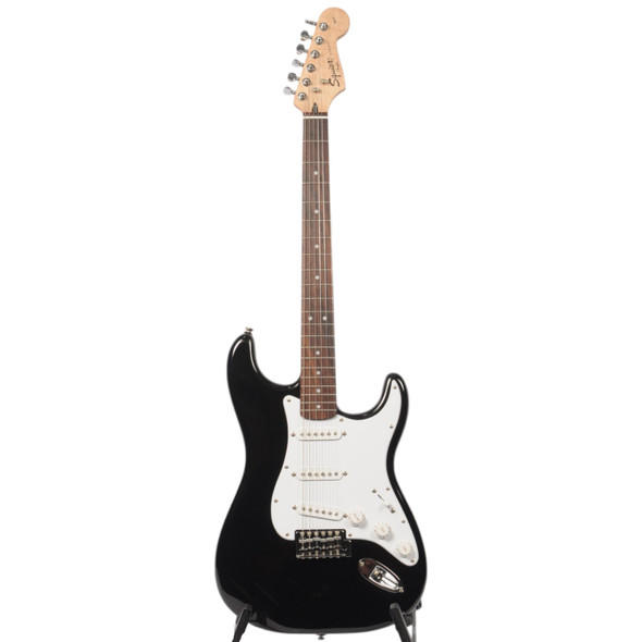Full front view of a used Squier Affinity Strat electric guitar in black with a maple neck and white pickguard. card