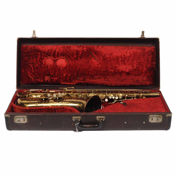 Open vintage hard case with red plush interior holding the used 1939 King Zephyr tenor saxophone.