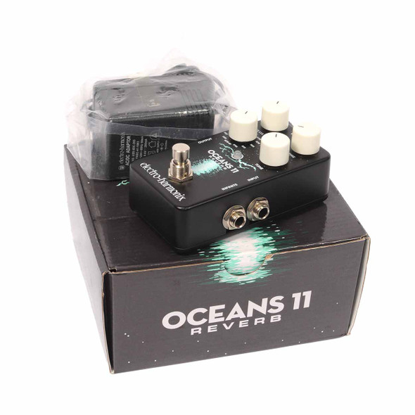 Electro-Harmonix Oceans 11 Reverb pedal with original box and power adapter displayed beside the pedal. card
