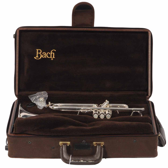 Interior view of the Bach Stradivarius hard case with the trumpet secured inside and accessories compartment visible. card