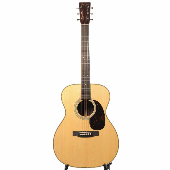 Full front view of the acoustic guitar with a natural top and dark fingerboard. card