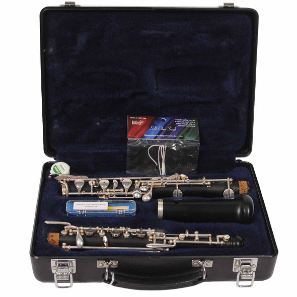 Open Selmer oboe case containing the disassembled 1492B oboe, bell, reeds, swab, and accessories. card