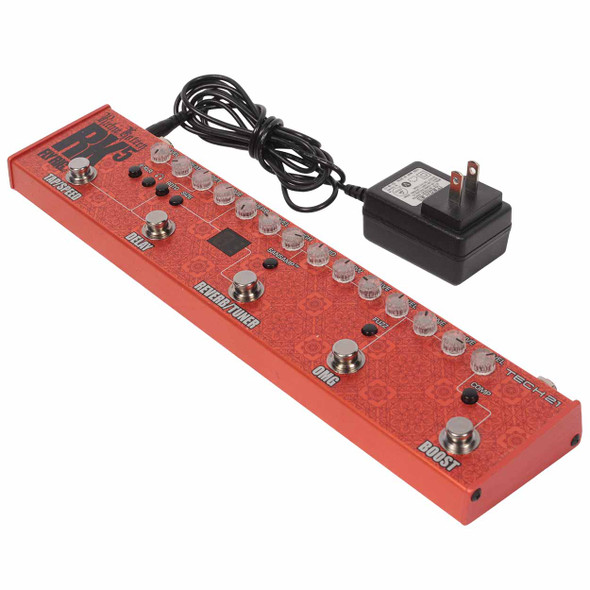 Angled view of the RK5 Fly Rig v2 with its included power adapter. card