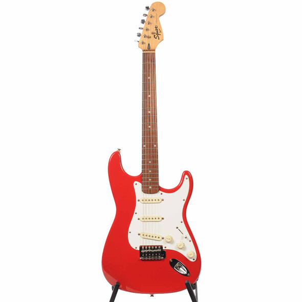 Full front view of red Squier Stratocaster with maple neck and rosewood fingerboard. card
