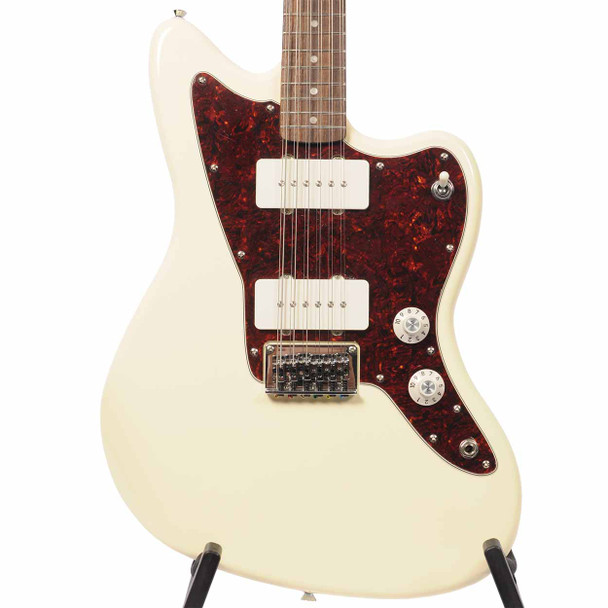 Front close-up of Squier Paranormal Jazzmaster XII 12-string electric guitar in Olympic White with tortoiseshell pickguard, dual soapbar pickups, and adjustable bridge. card