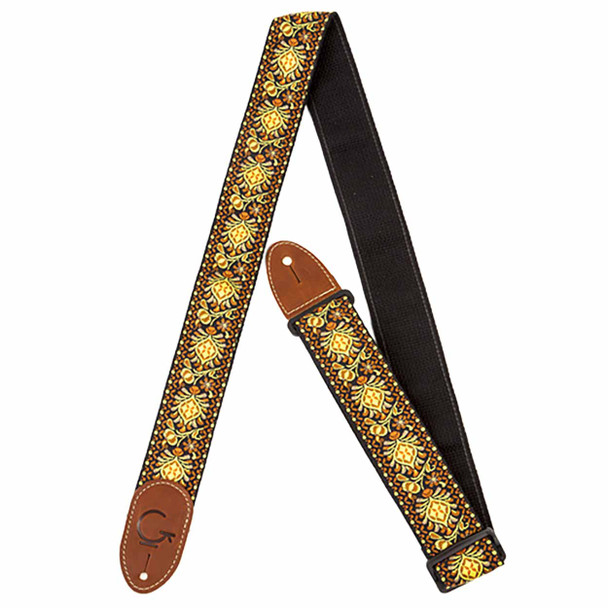Black woven guitar strap with gold and orange floral embroidered pattern, black web backing, and brown leather ends. card