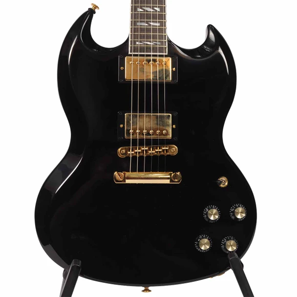 Close front view of Gibson SG Supreme in Ebony showing dual humbuckers, gold hardware, four controls, and double-cutaway body. card