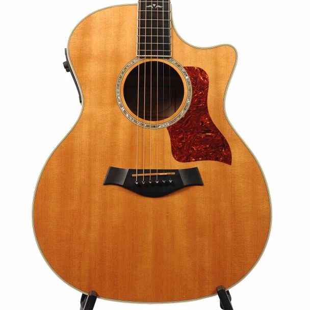 Front body close-up of Taylor 614ce with natural finish, abalone rosette, tortoiseshell pickguard, and cutaway. card