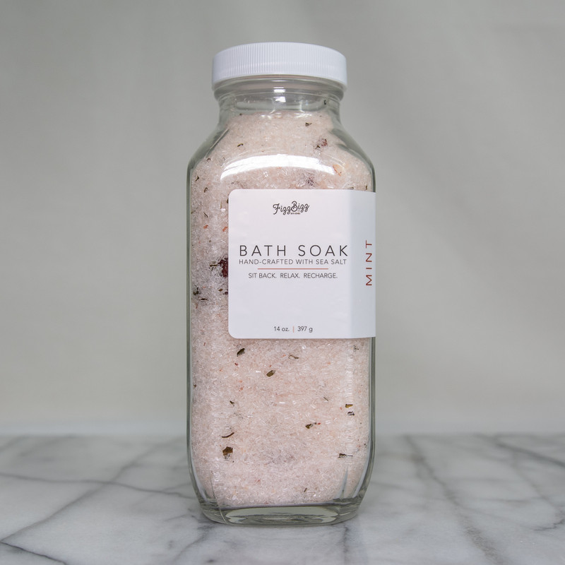 The front view of our Mint premium bath salts. A 14 oz jar of bliss in a bottle. 