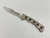 Pre-Owned Buck 560 Stainless Clip Point Blade, Titanium Handle (Condition: Lightly Used, Box: No)