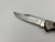 Pre-Owned Buck 560 Stainless Clip Point Blade, Titanium Handle (Condition: Lightly Used, Box: No)