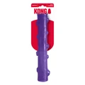 Purple stick-shaped dog toy with raised bumps. Shown in its retail packaging.