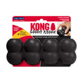 Black cylindrical dog toy with three stacked tiers and textured surface. Shown in its retail packaging.