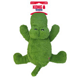 Green alligator-shaped dog toy with soft plush material. Shown in its retail packaging.