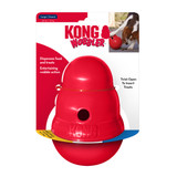 Red beehive-shaped treat dispensing dog toy with center hole. Shown in its retail packaging.