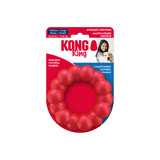 Red ring shaped dog toy with rounded texture all the way around.  Shown in its retail packaging.