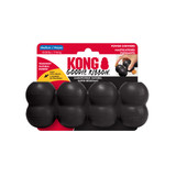 Black cylindrical dog toy with three stacked tiers and textured surface. Shown in its retail packaging.