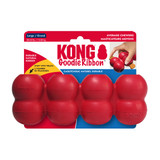 Red cylindrical dog toy with three stacked tiers and textured surface. Shown in its retail packaging.