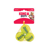 Neon green tennis ball dog toy with KONG printed. Shown in its retail packaging.