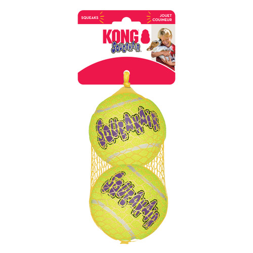 Neon green tennis ball dog toy with KONG printed. Shown in its retail packaging.