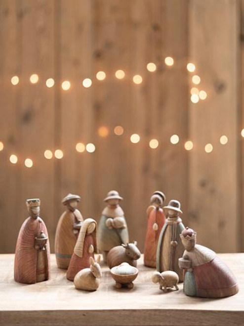 Image shows a Nativity set made of resin and featuring 11 resin figurines in warm, earthy tones.