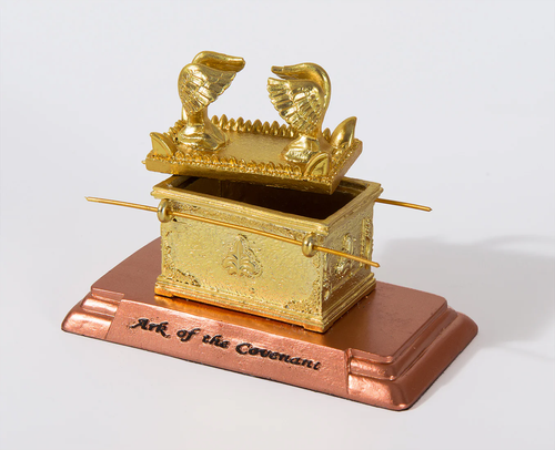 Image shows a crafted Ark of the Covenant replica, inspired by the sacred artifact described in Exodus 25:8. This small-scale model  includes symbolic elements.