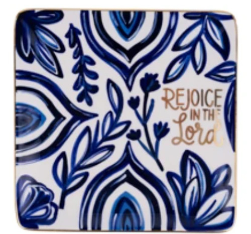Image shows a Rejoice in the Lord Trinket Tray featuring a blue background and hand-painted details on this 6" x 6" ceramic tray.