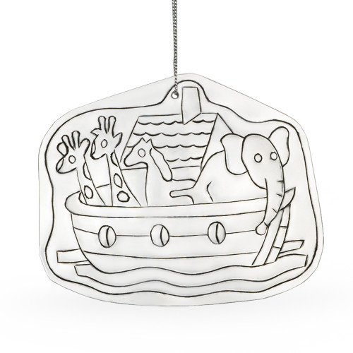 Image shows a Noah’s Ark tin ornament created by artisans through Thai Village’s fair-trade initiative.