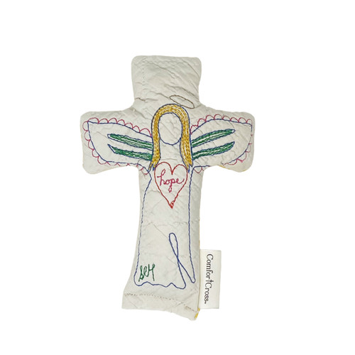 Image shows the front of a handmade quilted Comfort Cross –Angel Joy with green wings