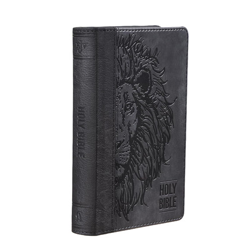 The image shows a lion's face embedded on the front cover of the compact KJV Holy Bible.