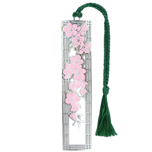 The image shows a metal cherry blossom bookmark.