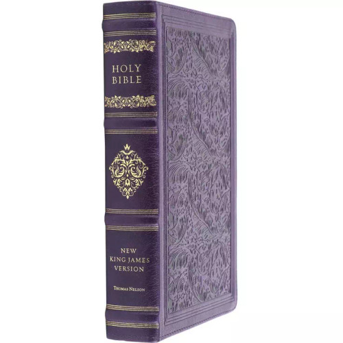 The image shows the spine of an NKJV Sovereign Reference Bible, in purple.