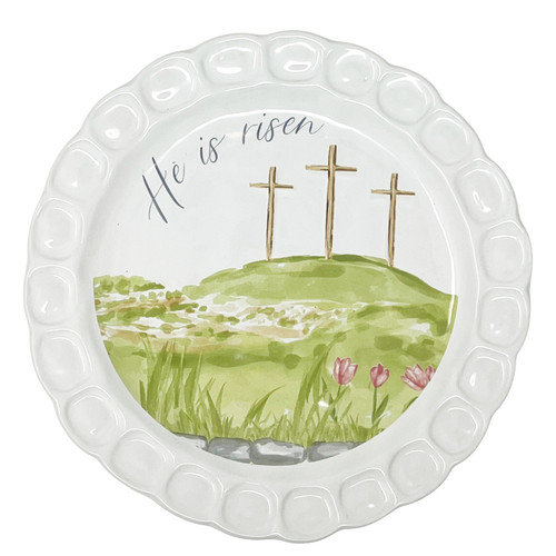 The image shows the "He Is Risen" plate featuring three crosses on a green hillside. 
