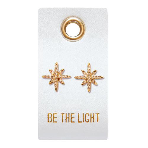 The image shows Be The Light stud earrings on its packaging. 