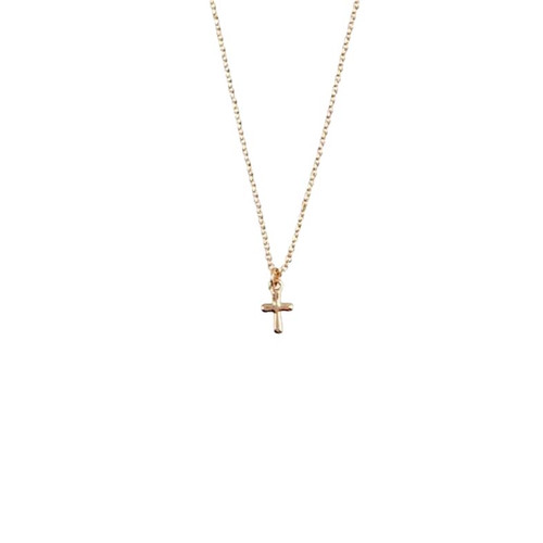 The image shows a children's gold cross necklace.