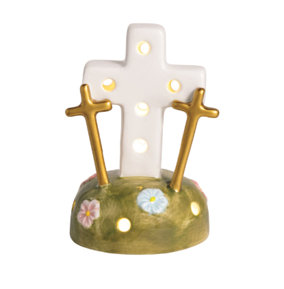 The image shows a close-up view of a three-crosses light‑up sitter.