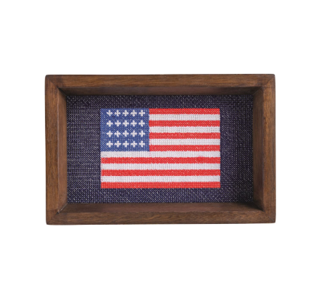 The image shows a needlepoint flag.