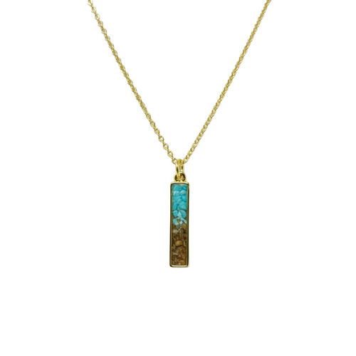 The image shows an Explorer Necklace Bar made with sand from Qumran and featuring turquoise stones.  
