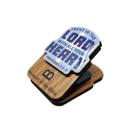 The image shows a side view of this sticker art magnet clip featuring the words,  Trust in the Lord.
