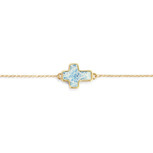 The image shows a close-up of the cross on the Hope Artful Cross Bracelet, in white and blue.