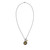 Image shows a view of this Magdala dangle charm necklace on a flat surface. 