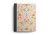 Image shows an ESV Single Column Journaling Bible from the Artist Series, called "In Bloom" on a flat surface.