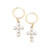 The image shows the Emily Pearl Cross Drop Hoop Earrings in ivory.