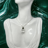 Clear Quartz Earth Heart with Moldavite Clear Quartz Earth Heart with Moldavite