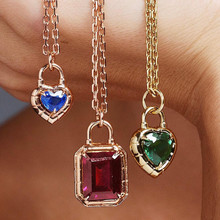 heart shaped sapphire padlock pendant in 18 karat gold front view; sapphire heart pendant